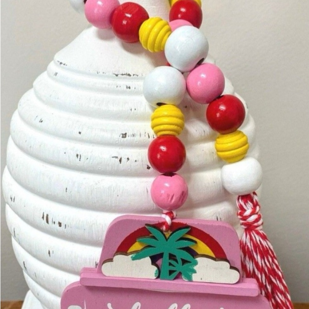 Summertime Pink truck with palms  and hello on the tailgate with colorful beads.